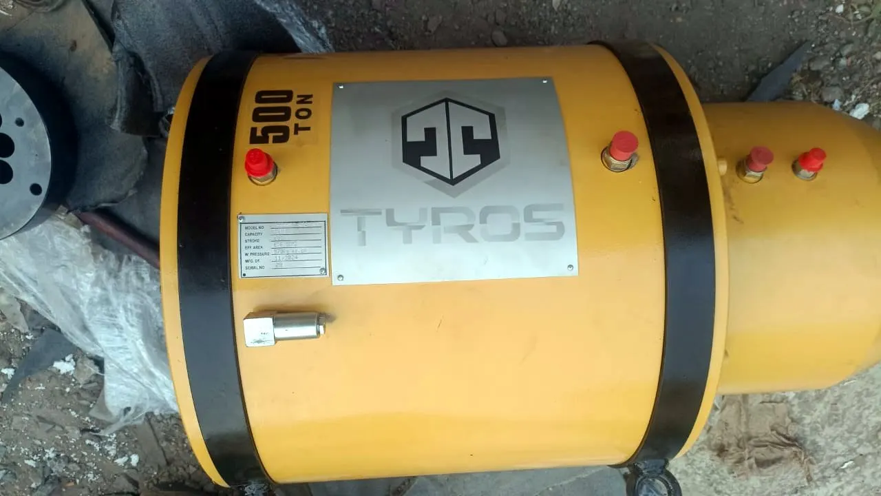 Yellow TYROS 500 tonne multi-strand stressing jack